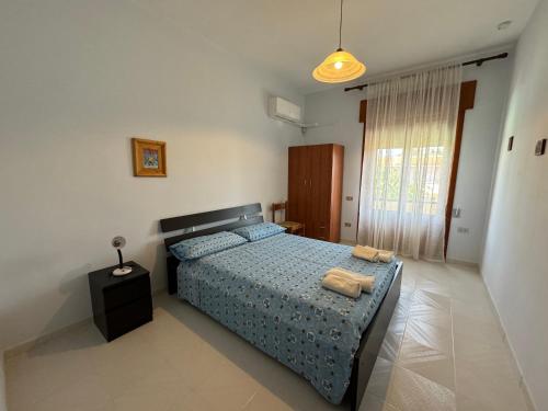 Postel nebo postele na pokoji v ubytování Residenza Tafuri