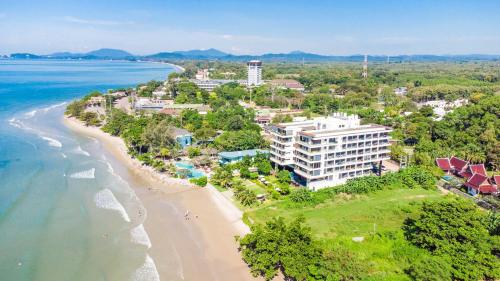 an aerial view of the beach and the ocean at Escape Condominiums Beachfront Suites - Mae Phim in Rayong