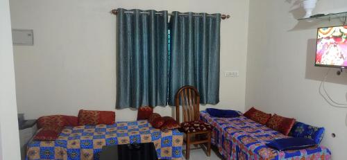 Телевизор и/или развлекательный центр в Dreams home estate stay coorg B