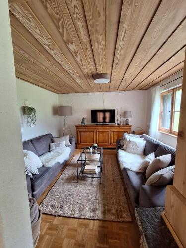 a living room with a couch and a tv at St Wendelin in Sücka