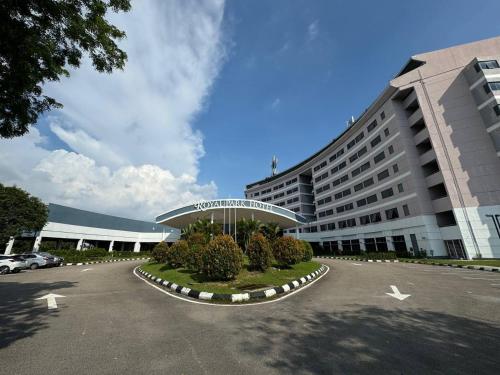a large building with a parking lot in front of it at ROYAL PARK HOTEL @ UNITEN in Kajang