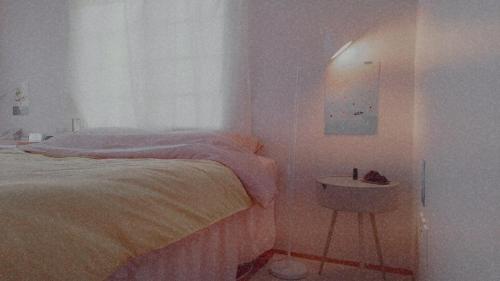 Кровать или кровати в номере Jeju Guest Room
