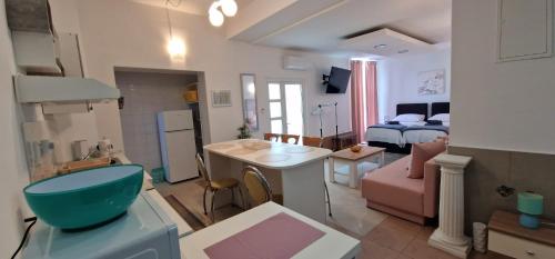 a small apartment with a bedroom and a living room at Carla Apartment Opuzen Modern Oasis and Comfort in Opuzen