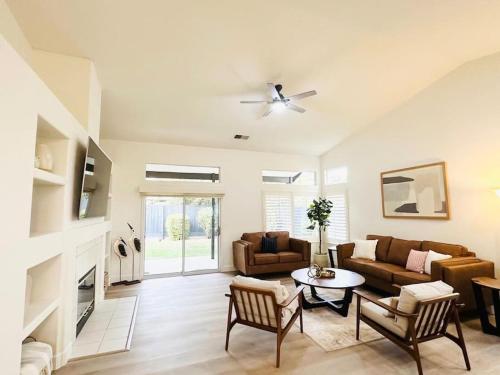 a living room with a couch and a table at Charming retreat in CA Valley in Fresno