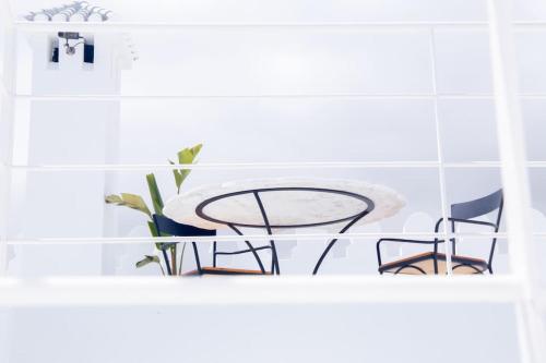a table and two chairs sitting on a shelf at CASA SIRA-Charming home in the heart of the Kasbah in Tangier