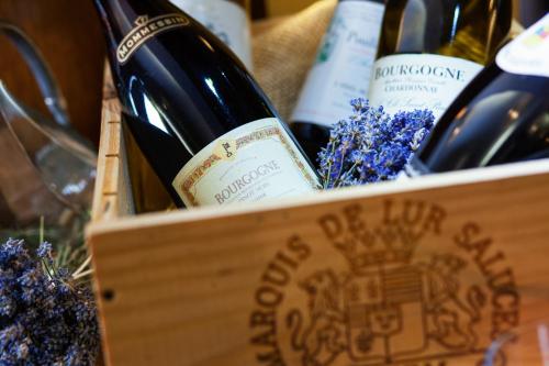 a wooden box filled with bottles of wine at Hotel Abácie & Wellness in Valašské Meziříčí