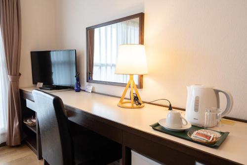 Télévision ou salle de divertissement dans l'établissement Sapporo Clark Hotel