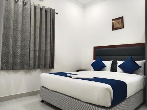 Ένα ή περισσότερα κρεβάτια σε δωμάτιο στο Residence Retreat Service Apartments