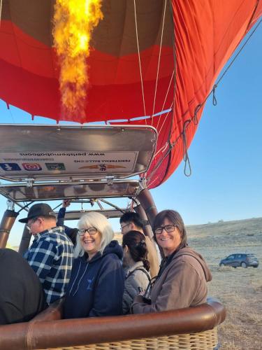 a group of people riding in a hot air balloon at Alis Home Pamukkale in Pamukkale