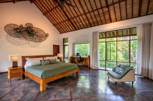 Ένα ή περισσότερα κρεβάτια σε δωμάτιο στο Ananda Villas Bali