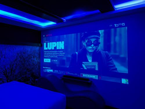 a television screen with a lupin website on it at Cupid Hotel in Ho Chi Minh City