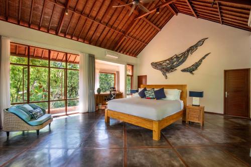Ένα ή περισσότερα κρεβάτια σε δωμάτιο στο Ananda Villas Bali