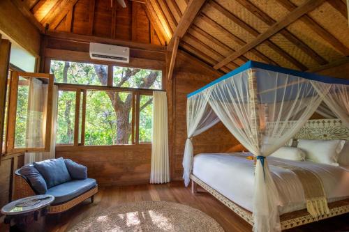 Ένα ή περισσότερα κρεβάτια σε δωμάτιο στο Ananda Villas Bali