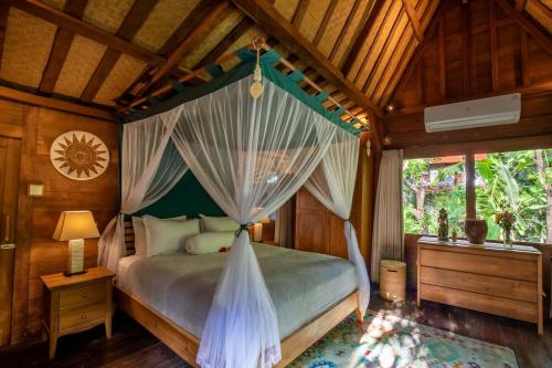 Ένα ή περισσότερα κρεβάτια σε δωμάτιο στο Ananda Villas Bali