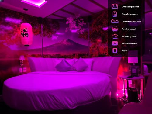 a purple bedroom with a bed with a mountain in the background at Cupid Hotel in Ho Chi Minh City