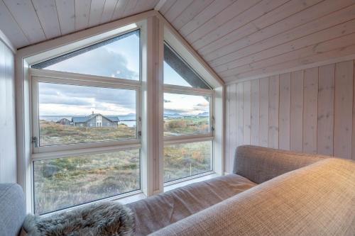 Postel nebo postele na pokoji v ubytování Lofoten Links Lodges