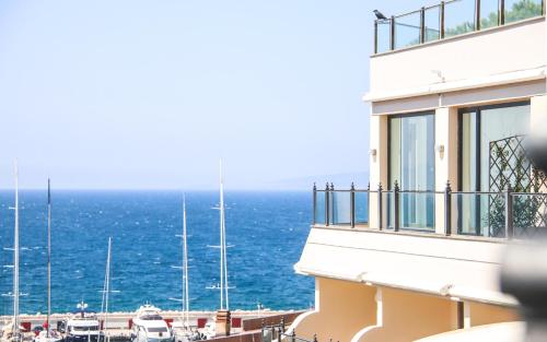 a view of the ocean from a building at Cala del Porto Punta Ala - Preferred Hotels in Punta Ala