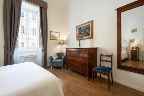 Postel nebo postele na pokoji v ubytování Palazzo D'Ambra Residenza d'Epoca