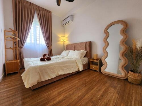 a bedroom with a bed with a teddy bear on it at UKM Bangi Wonderland 3BR 2bath 2parking in Kampong Tangkas