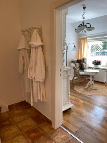 a room with a hallway with a room with a table and a room at Erholung am Deich in Glückstadt