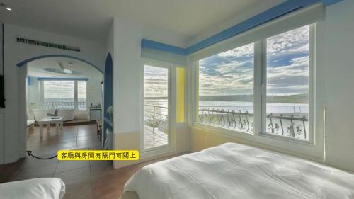 Postel nebo postele na pokoji v ubytování 南灣飯店 Kenting Nanwan Hotel