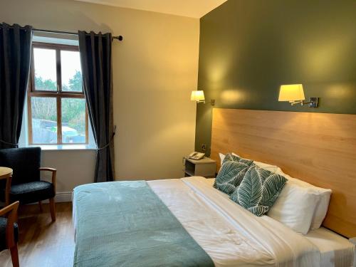 The Coach House Hotelにあるベッド
