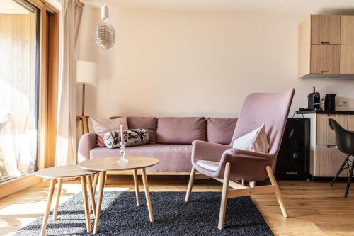 a living room with a couch and a table at Design Apartment Au - Voralberg in Au