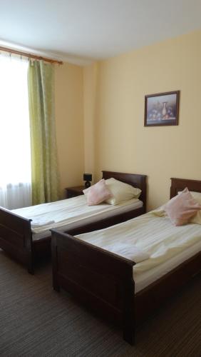 Hotel Pan Tadeuszにあるベッド