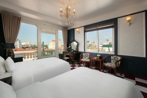 Cama o camas de una habitación en Delica Premium Hotel