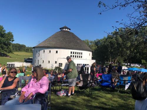 a group of people sitting in chairs in front of a building at Great Escape in New Buffalo
