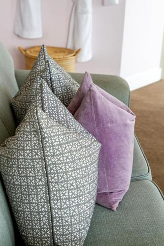 a group of pillows sitting on a couch at Royal Boutique Hotel in Cape Town