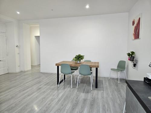 a dining room with a table and chairs at Be Your Home - Guest House Il Ferroviere in Civitavecchia