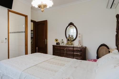 Ένα ή περισσότερα κρεβάτια σε δωμάτιο στο Quinta do Passal - Gondoriz