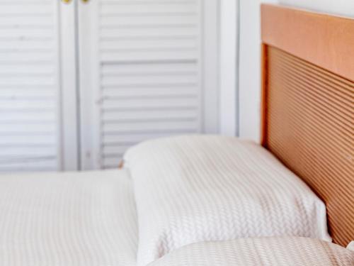 Ένα ή περισσότερα κρεβάτια σε δωμάτιο στο Roc Portonova Apartaments