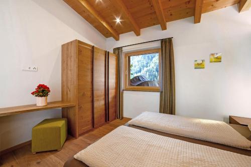 Postel nebo postele na pokoji v ubytování Chalet Resort Innerluferhof