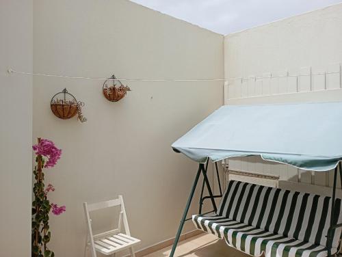 a small room with a table and a chair at casa Emilia Cotillo Mar in Cotillo