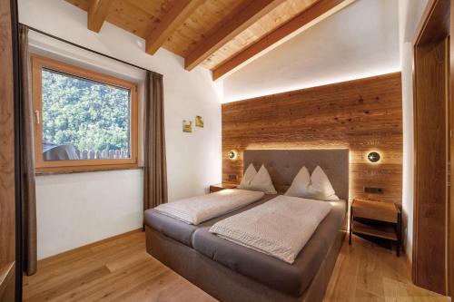 Postel nebo postele na pokoji v ubytování Chalet Resort Innerluferhof