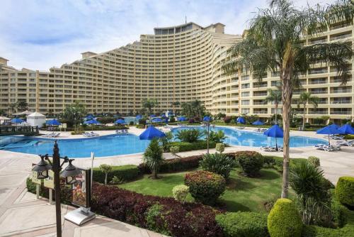 a large hotel with a large building in the background at Porto Sokhna Majestic in Ain Sokhna