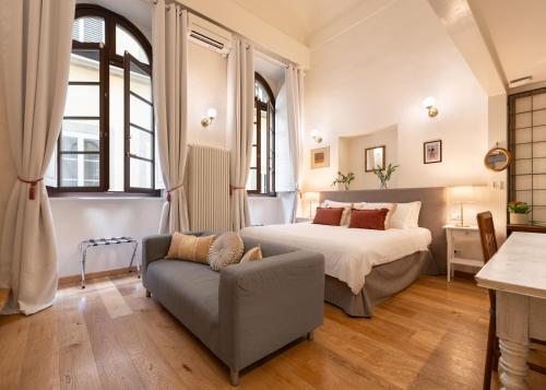 Postel nebo postele na pokoji v ubytování Palazzo D'Ambra Residenza d'Epoca