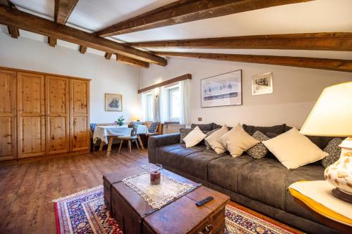 a living room with a couch and a table at Apartments Raphael in Ortisei