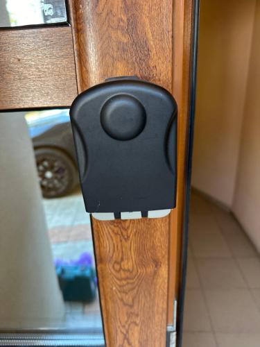 a close up of a wooden door with a black handle at PANORAMA APARTMENT in Montana