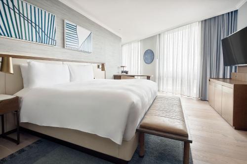 a hotel room with a large bed and a television at JW Marriott Hotel Mexico City Polanco in Mexico City