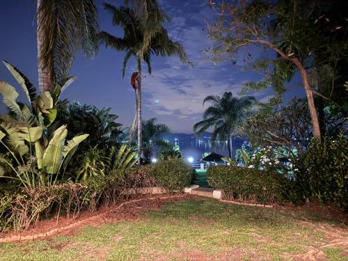 a view of the ocean from a resort at night at Olives by Agnes in Hartbeespoort