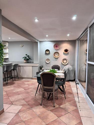 a dining room with a table and chairs at Olives by Agnes in Hartbeespoort