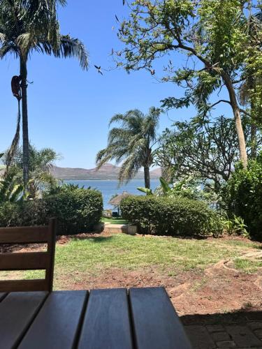 a picnic table with a view of the ocean at Olives by Agnes in Hartbeespoort