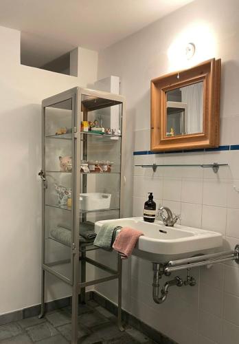 a bathroom with a sink and a mirror at Cherrytree Cottage 1840 in Heimbach