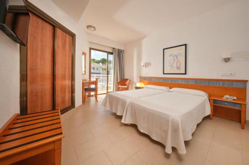 Postel nebo postele na pokoji v ubytování Hotel Casablanca