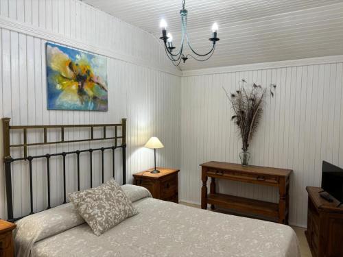 Ένα ή περισσότερα κρεβάτια σε δωμάτιο στο Apartamentos LA CASONA DE JARAIZ