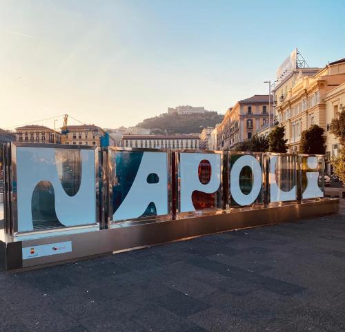 a large sign that says roar on the side of a street at Napoli Centro Casa Vacanza in Naples