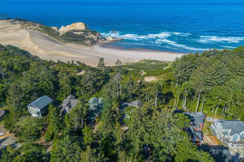 an aerial view of a house and a beach at Capeside Paradise in Pacific City
